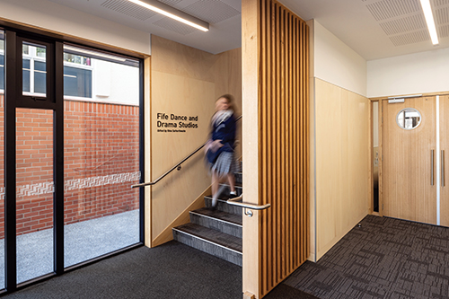 St Andrew's College student exiting the Fife Dance and Drama Studios at the Ngā Toi Performing Arts Centre.