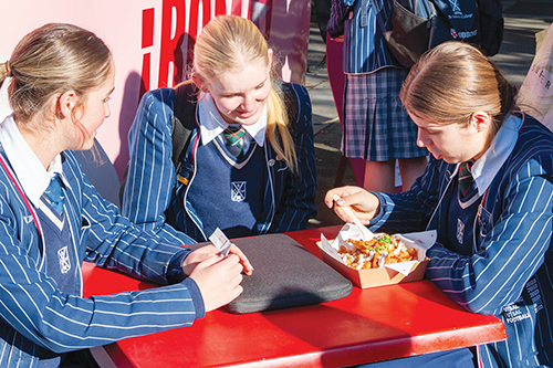 St Andrew's College students enjoying Mexican food from the Roma food truck.