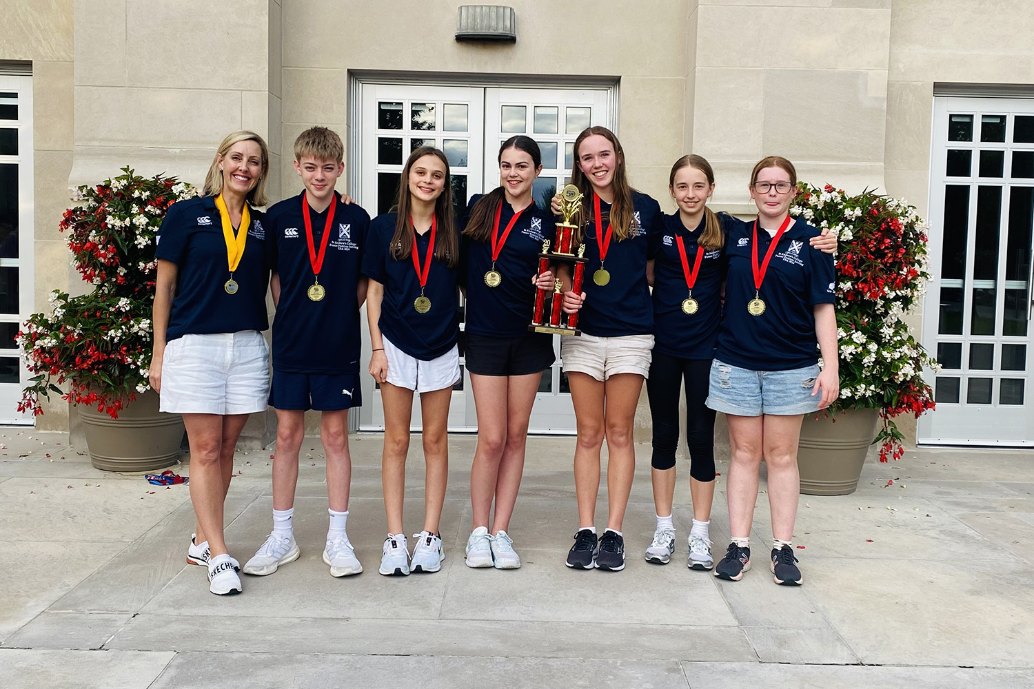 St Andrew's College Future Problem Solving coach Sonia Lewis with Year 9 students and their trophy.