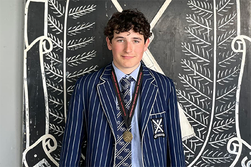 St Andrew's College student Kurt Lilly with his trap shooting medal.