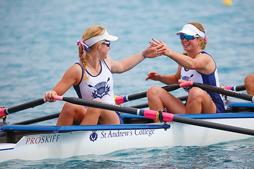 St Andrew's College students rowing.