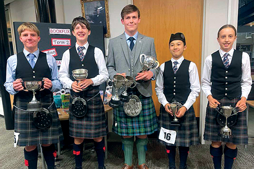 St Andrew's College students Ryley Medland, Lachlan Sneddon, Sam Foote, Anthony Song and Alice Glover with their piping and drumming awards.