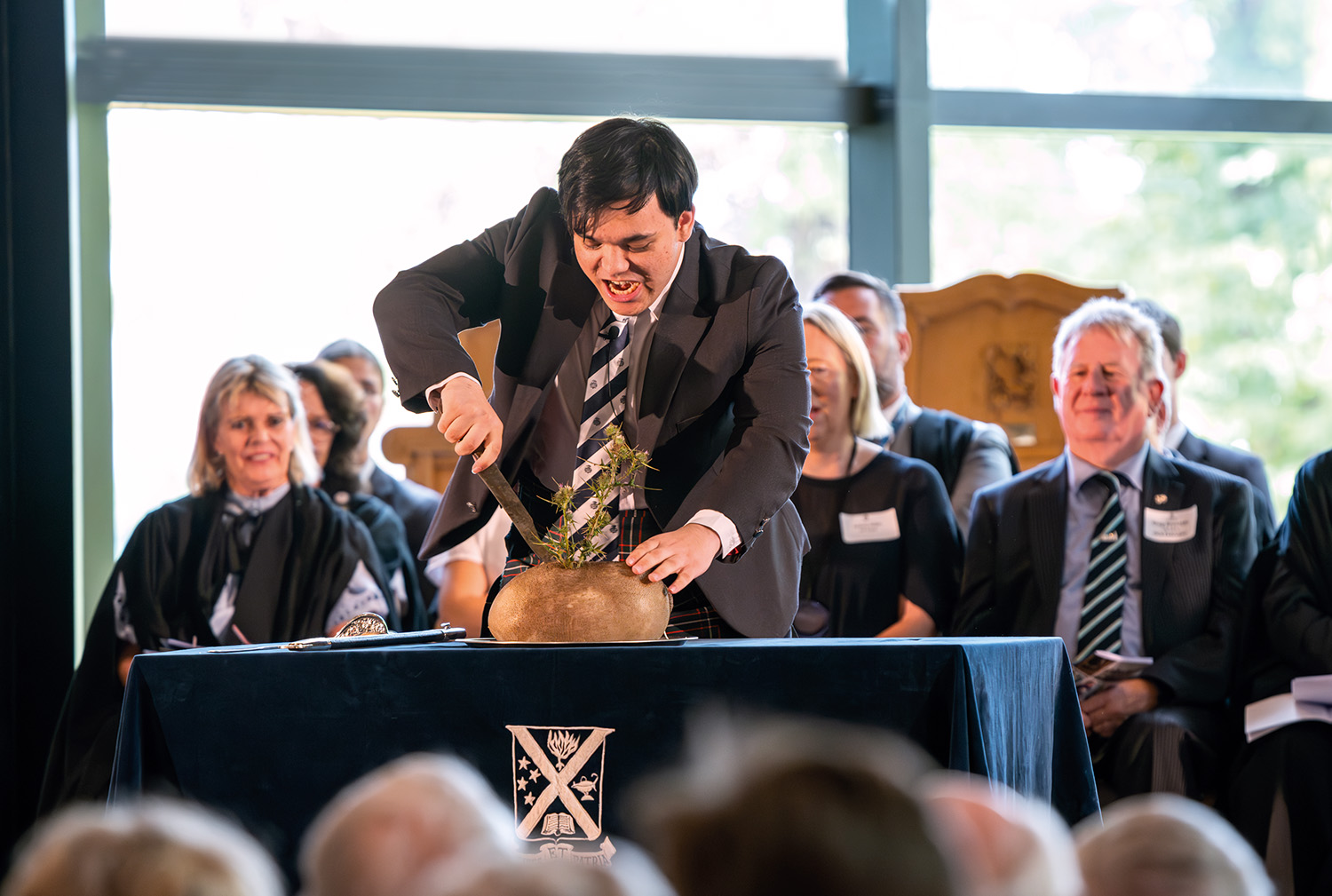 St Andrew's College student Matthew Lee performing Address to a Haggis at the 2024 Founders' Day Assembly.