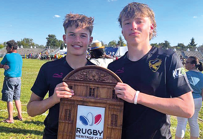 Findley Curtis (Y10 – right) with award from international rugby competition.