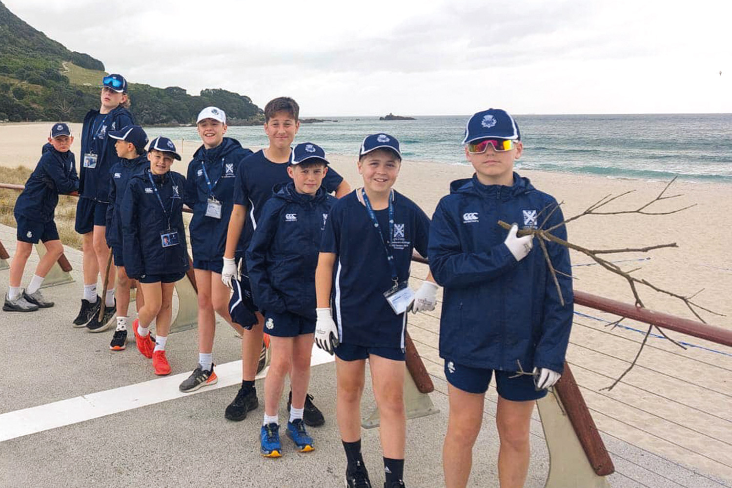 St Andrew’s College students during a beach clean up at the Zespri AIMS Games.