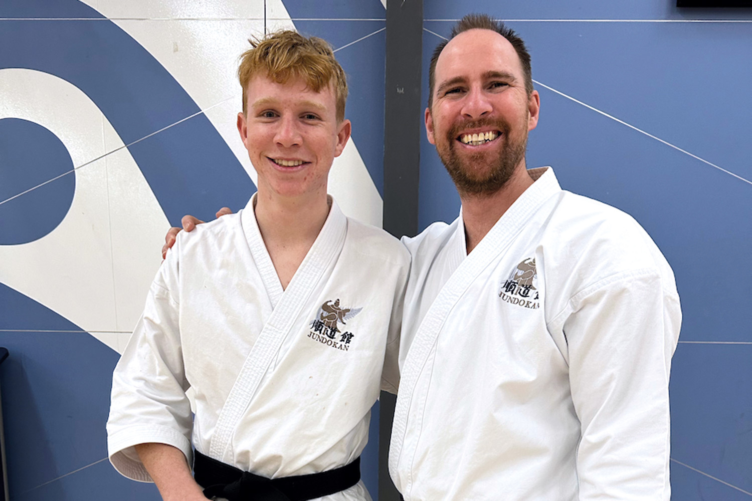 St Andrew's College student Corbin Revis and his karate instructor.