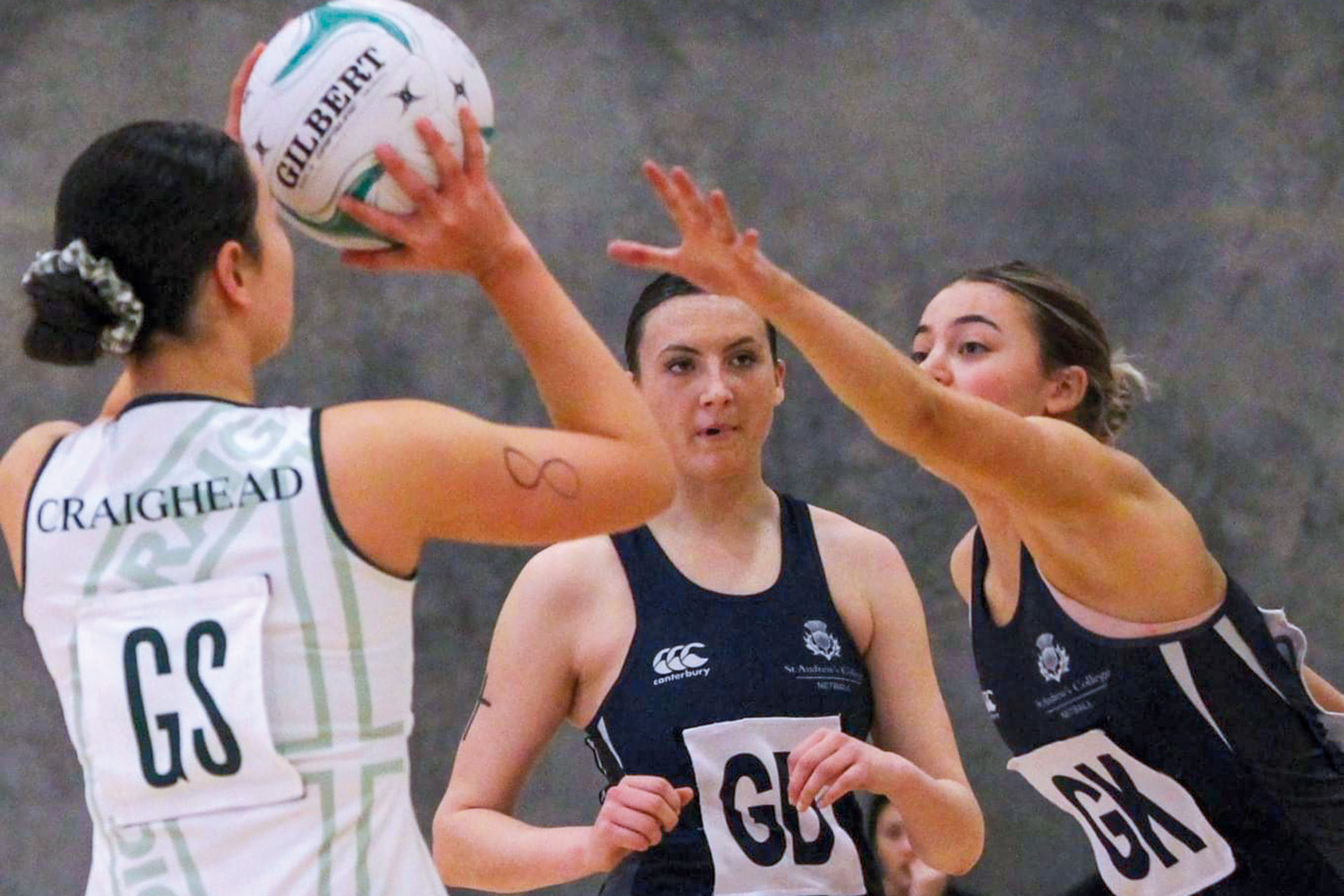 St Andrew's College students Milla Downing and Jody McCarthy-Dempsey playing Netball.