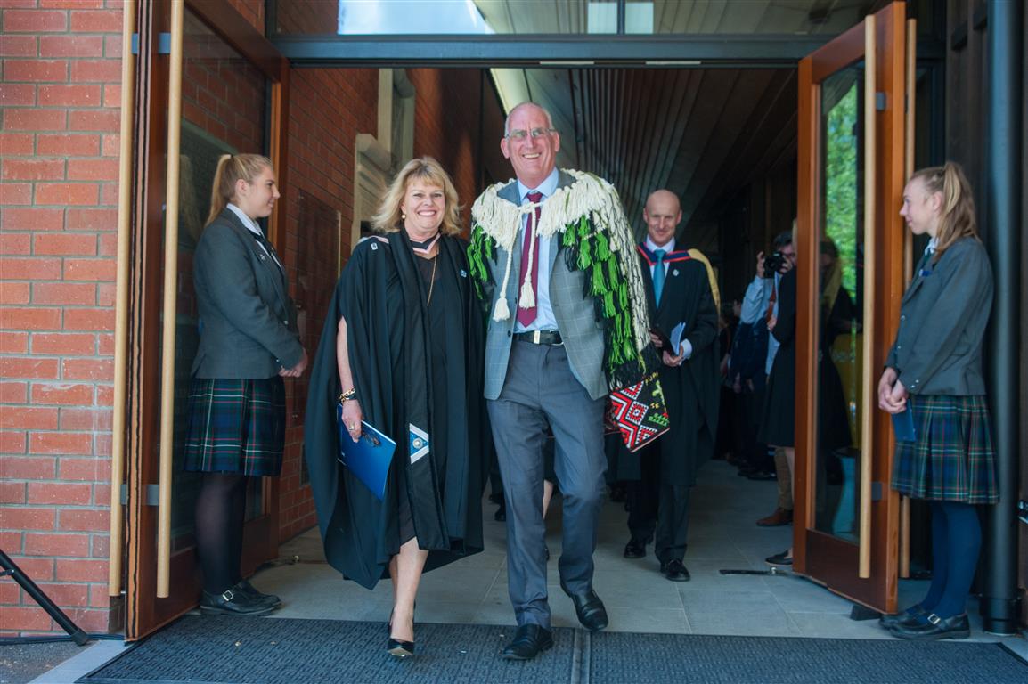 Rector, Christine Leighton and guest exiting the Centennial Chapel following the Centennial Chapel Dedication event