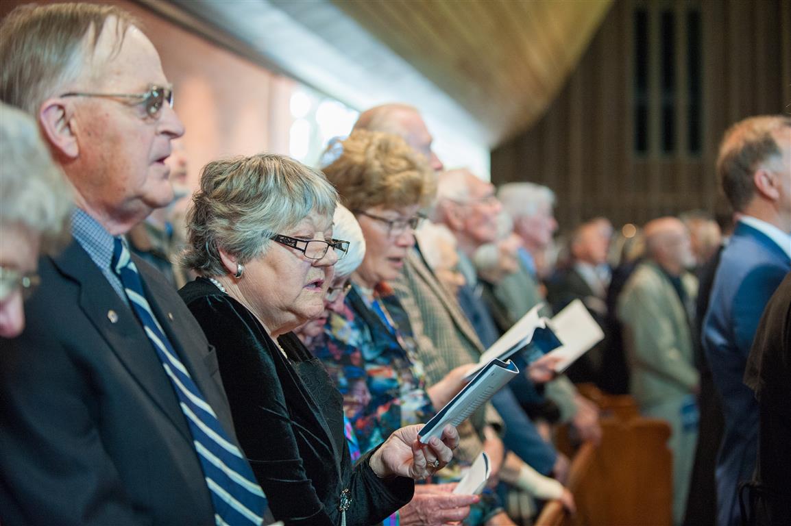 Guests singing during the Dedication of the Centennial Chapel