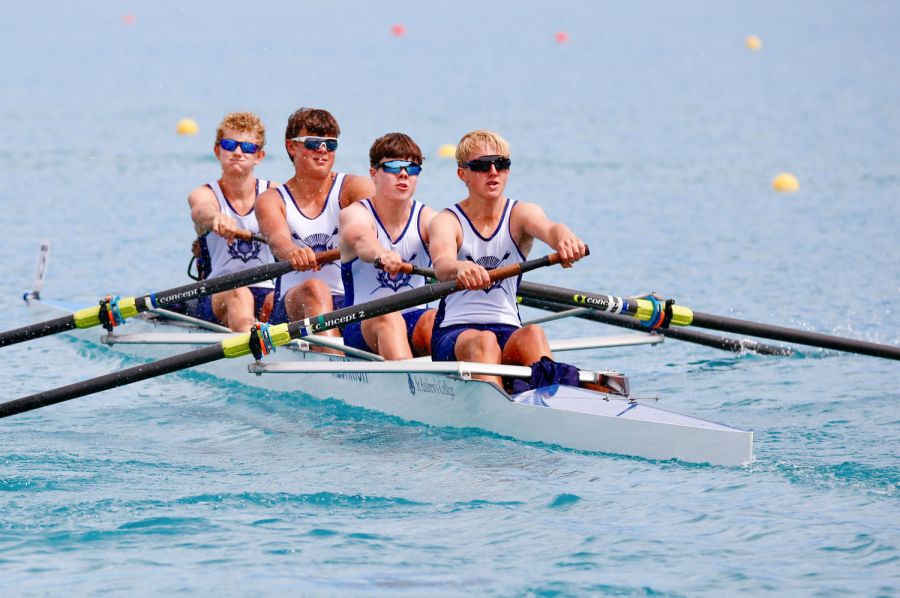 St Andrew's College four male rowers out on lake