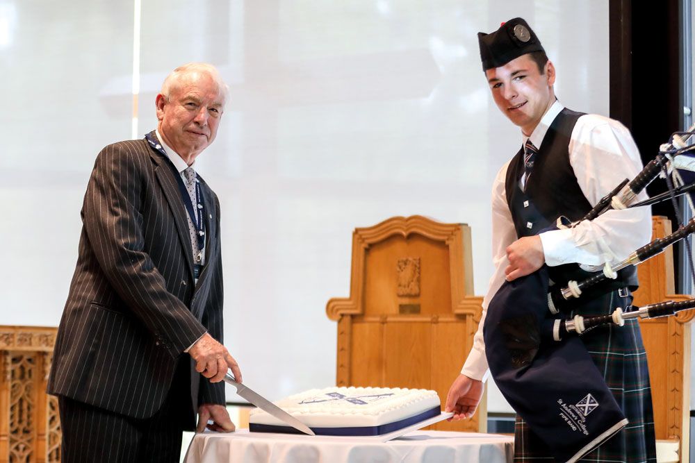 Cutting a cake during St Andrew's College Pipe Band centenary celebration on 16 March 2019.