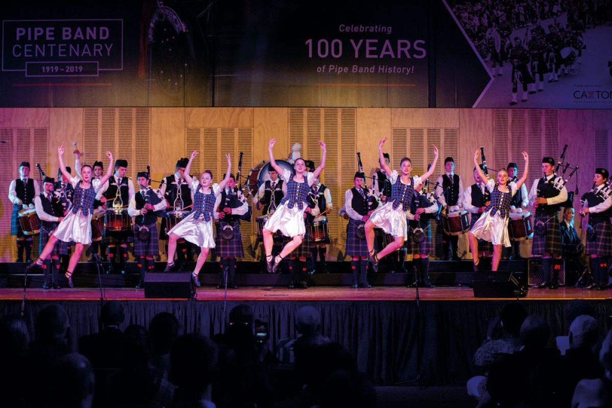 St Andrew's College Pipe Band and Highland dancers during concert.