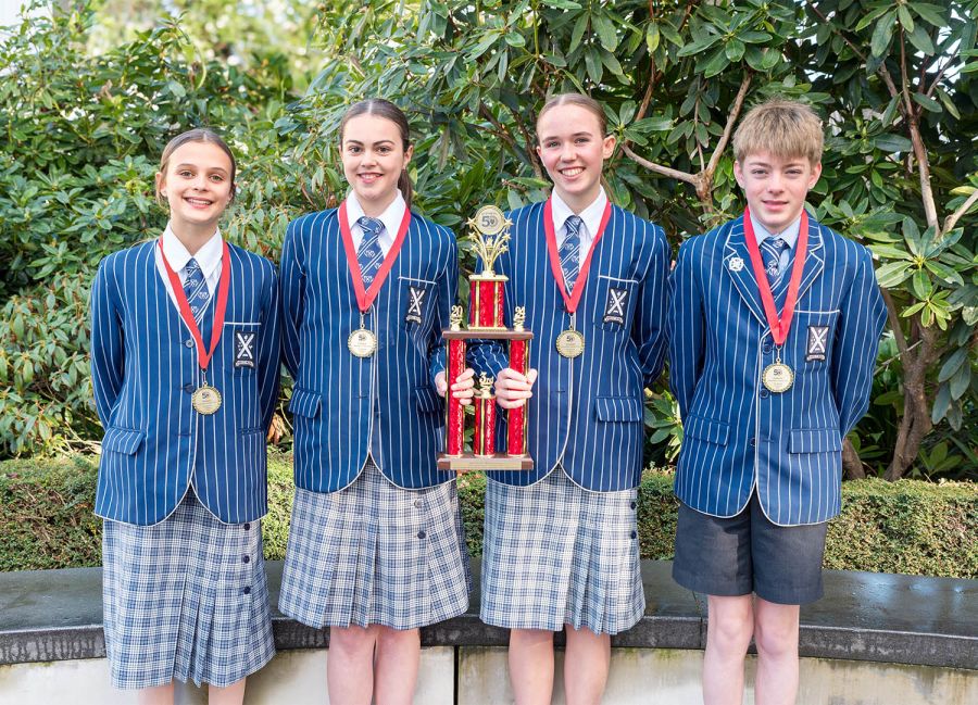 St Andrew's College Year 9 students Alexa Collis, Alyssa Geddes, Sophie Schouten and William Nicholls with their Future Problem Solving trophy.