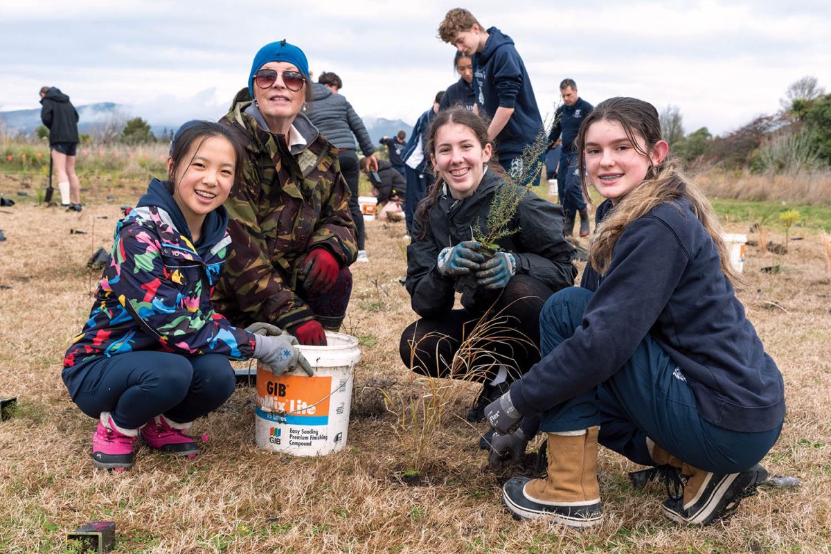 St Andrew's College Year 10 St Andrew's College students and staff member Ellen Hampson planting native trees in Christchurch's Red Zone.