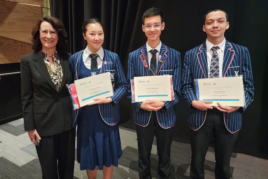St Andrew's College Assistant Head of Secondary School (Academic) Helaina Coote with students Chantelle Xiong, Sea-Am Thompson and Aaron Moore at the 2024 Academic Awards Night.