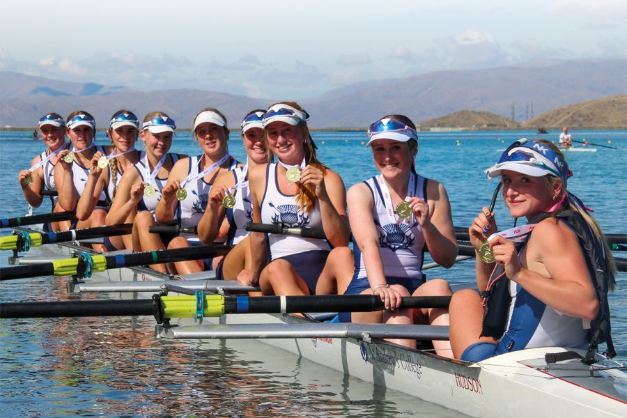 St Andrew's College U16 Girls' coxed eight with their gold medals at the 2024 Maadi Cup.