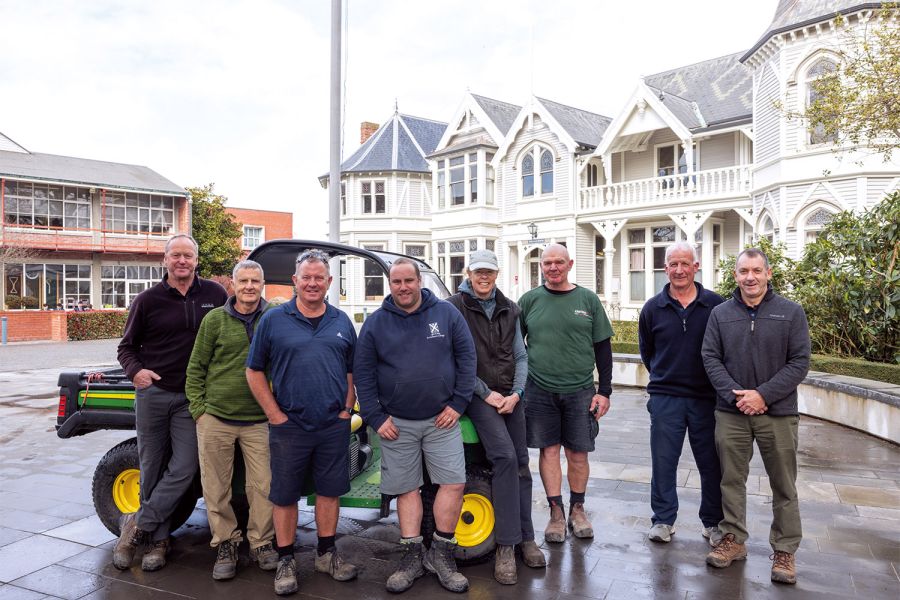 Eight staff members of the St Andrew's College Grounds and Facilities team.