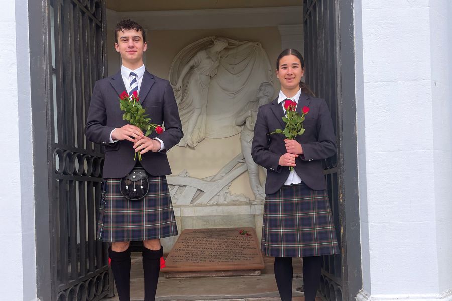 St Andrew's College students Jack Flanagan and Megan Simpson at Robert Burns’ grave at Dumfries, Scotland.