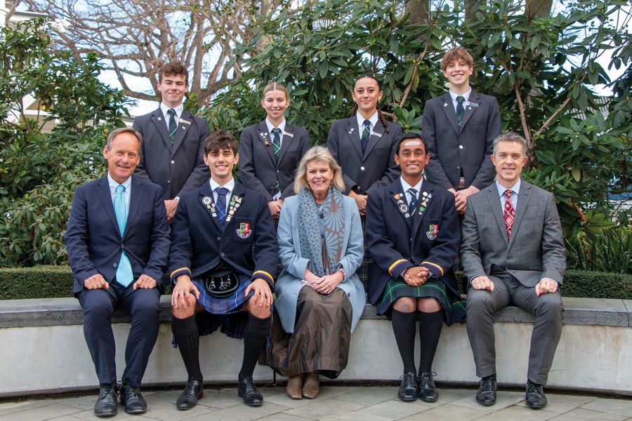 Otaki Scholars from Scotland visiting St Andrew's College and posing for a photo with Rector, Head of Secondary School, Head of Senior College and the four Student Heads of College.