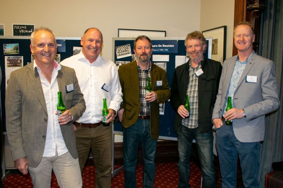 Five Old Collegians in the Strowan House staff room for 40 Years On Reunion