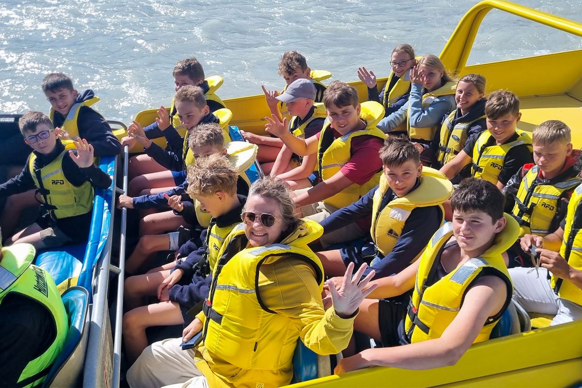 Boarding students and staff on a jet boat.