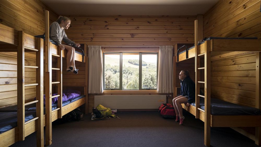 Castle Hill bunk room with students sitting on beds