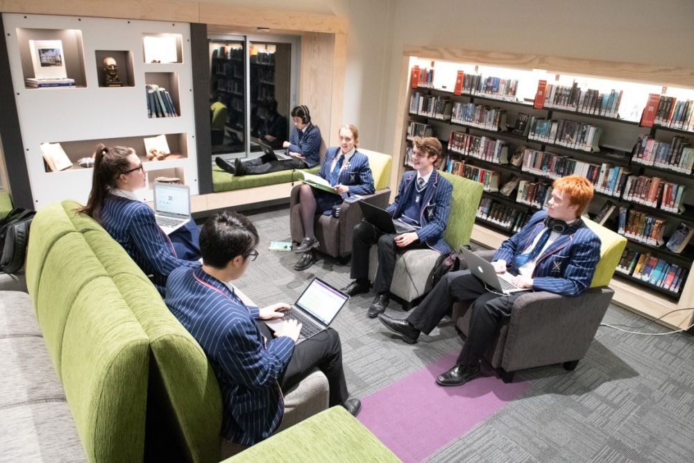 Students sat in Green Library and Innovation Centre on laptops