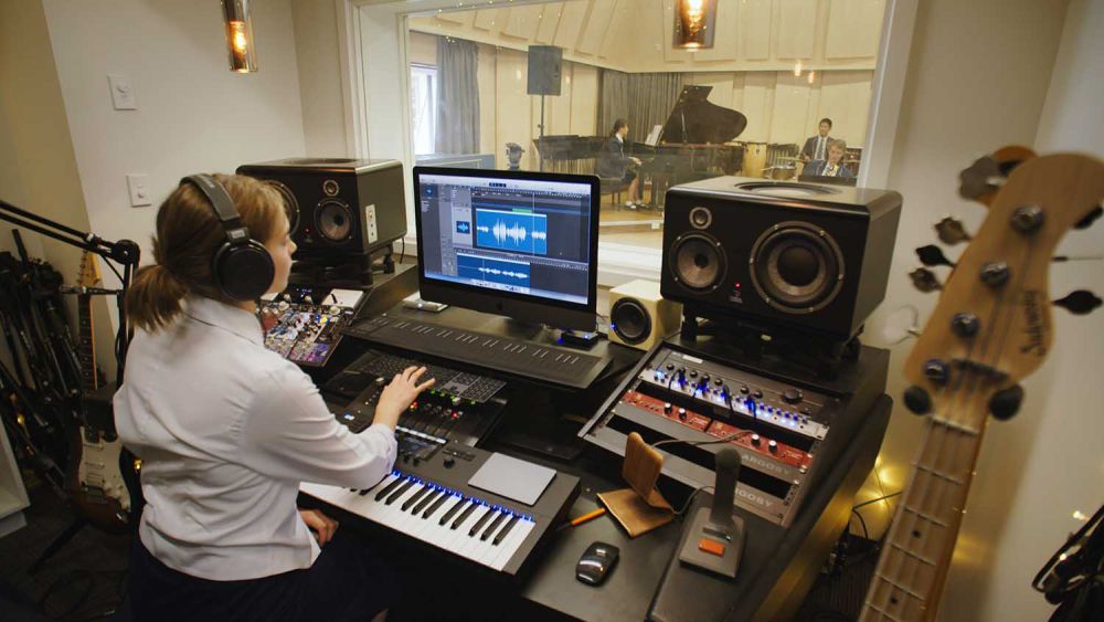 StAC music recording desk with student