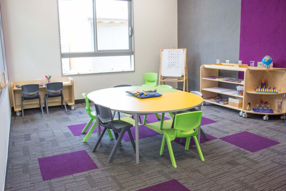 Pre-school interior classroom with chairs and tables