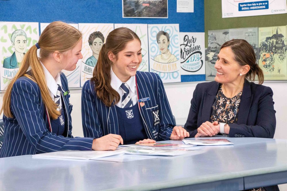 St Andrew's College Head of Well-being, Kerry Larby with two students.