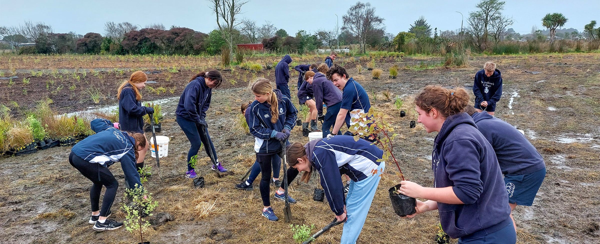 Students planting trees in the Christchurch redzone.