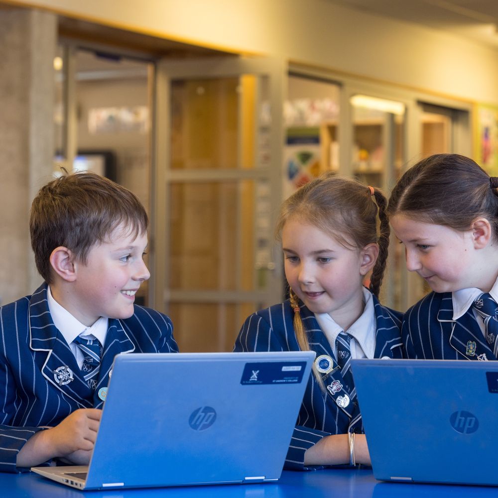 Preparatory students on laptops in the classroom.