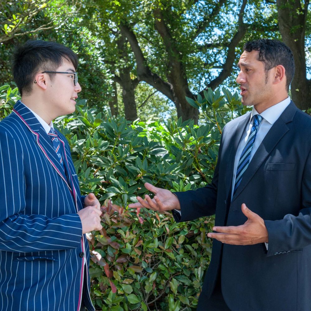 Pale Tauti Director of International Students and Exchanges talking outside with a student