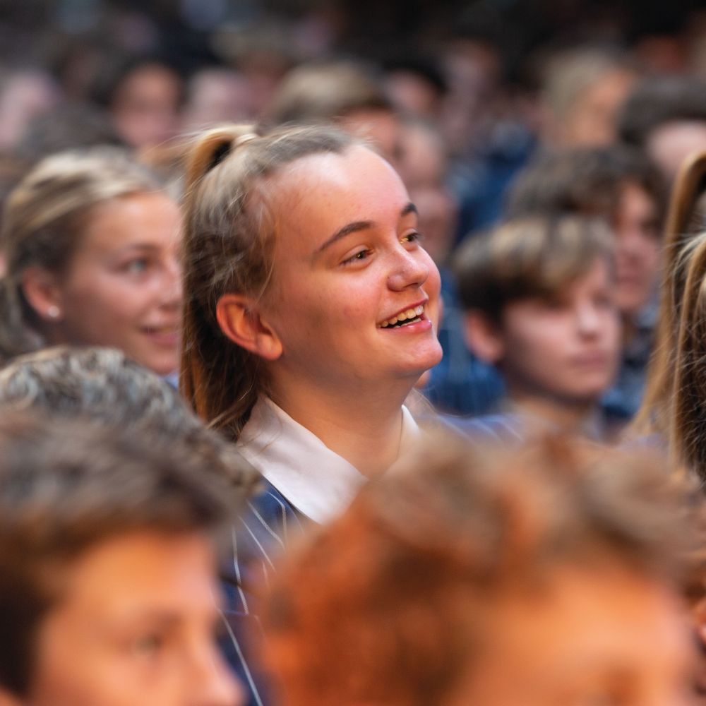 Female student in assembly