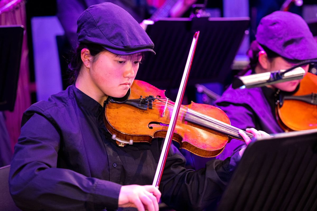 Violinist performing in the band for the production, Bright Star