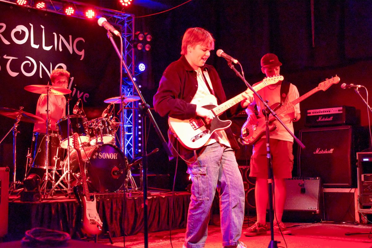 A rock band performing at A Rolling Stone
