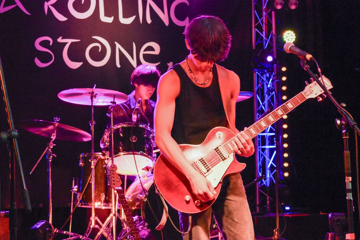 A rock band performing at A Rolling Stone