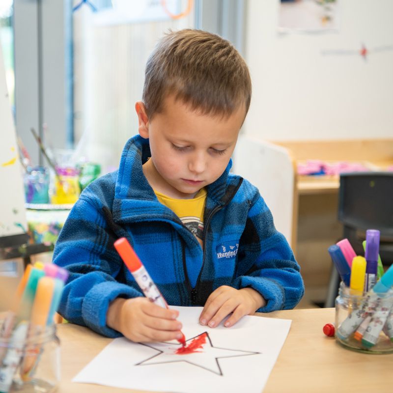 A child drawing in the pre-school.