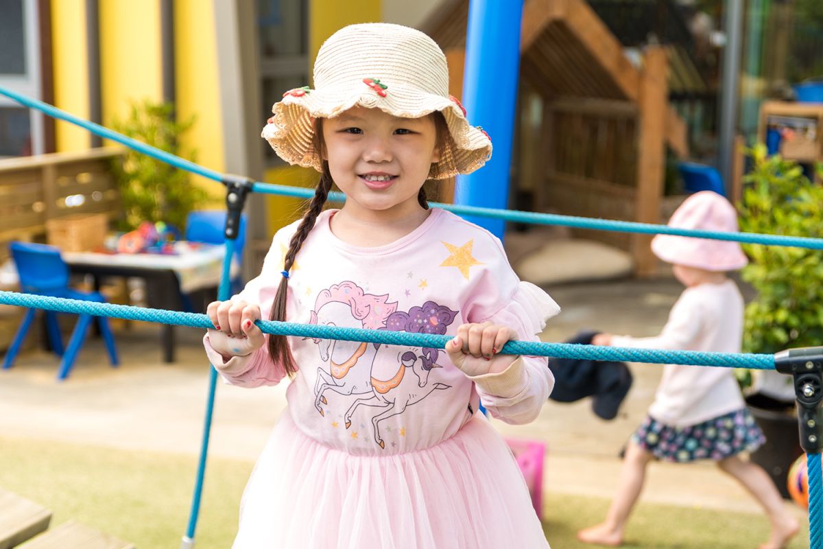 Child playing at the playground at St Andrew's College Pre-school.