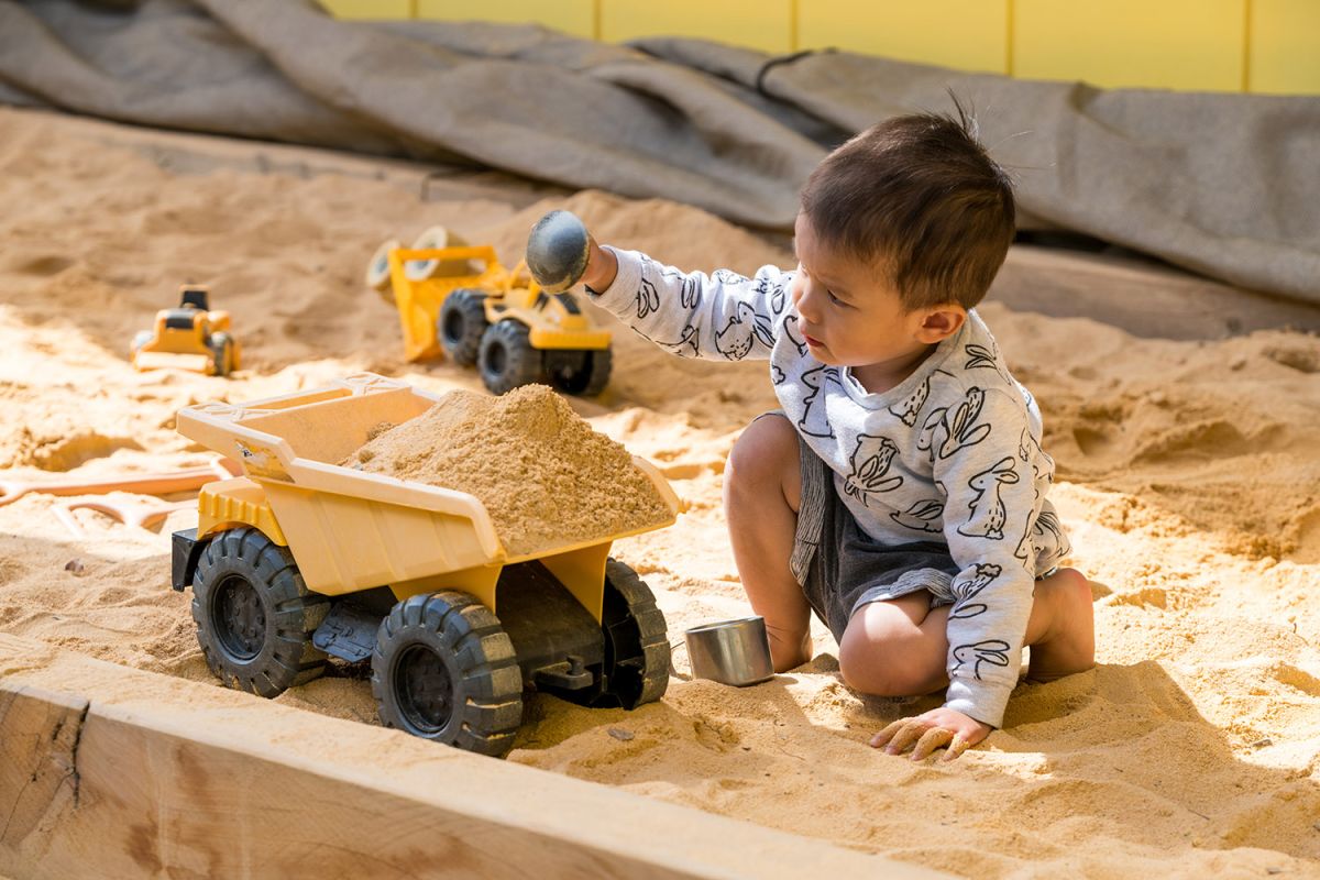 Child playing at the sandpit at St Andrew's College Pre-school.
