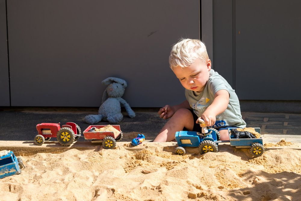 Child playing in the sandpit at St Andrew's College Pre-school.