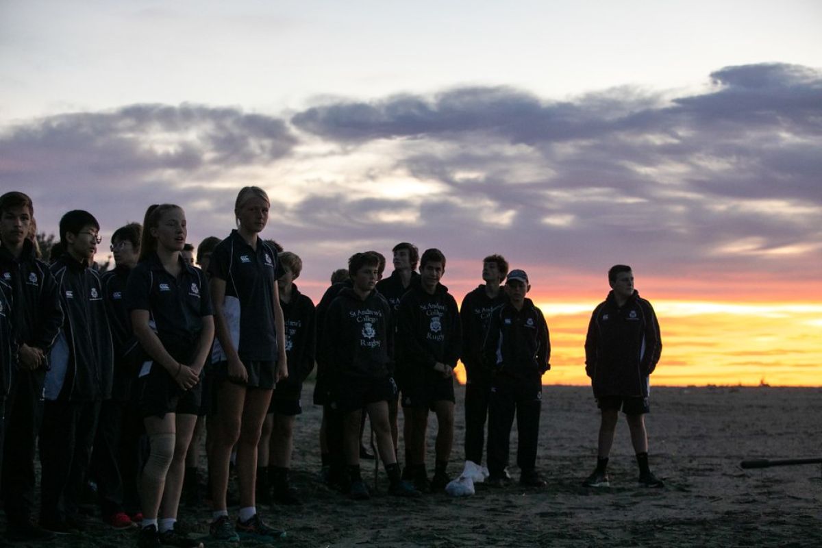 Students at a sunrise Te Waka calling ceremony