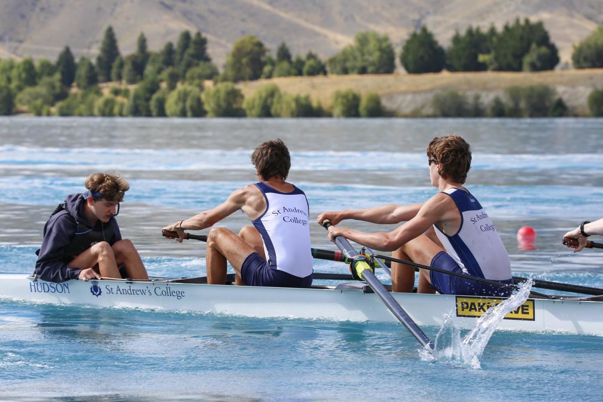 Students competing at a rowing competition