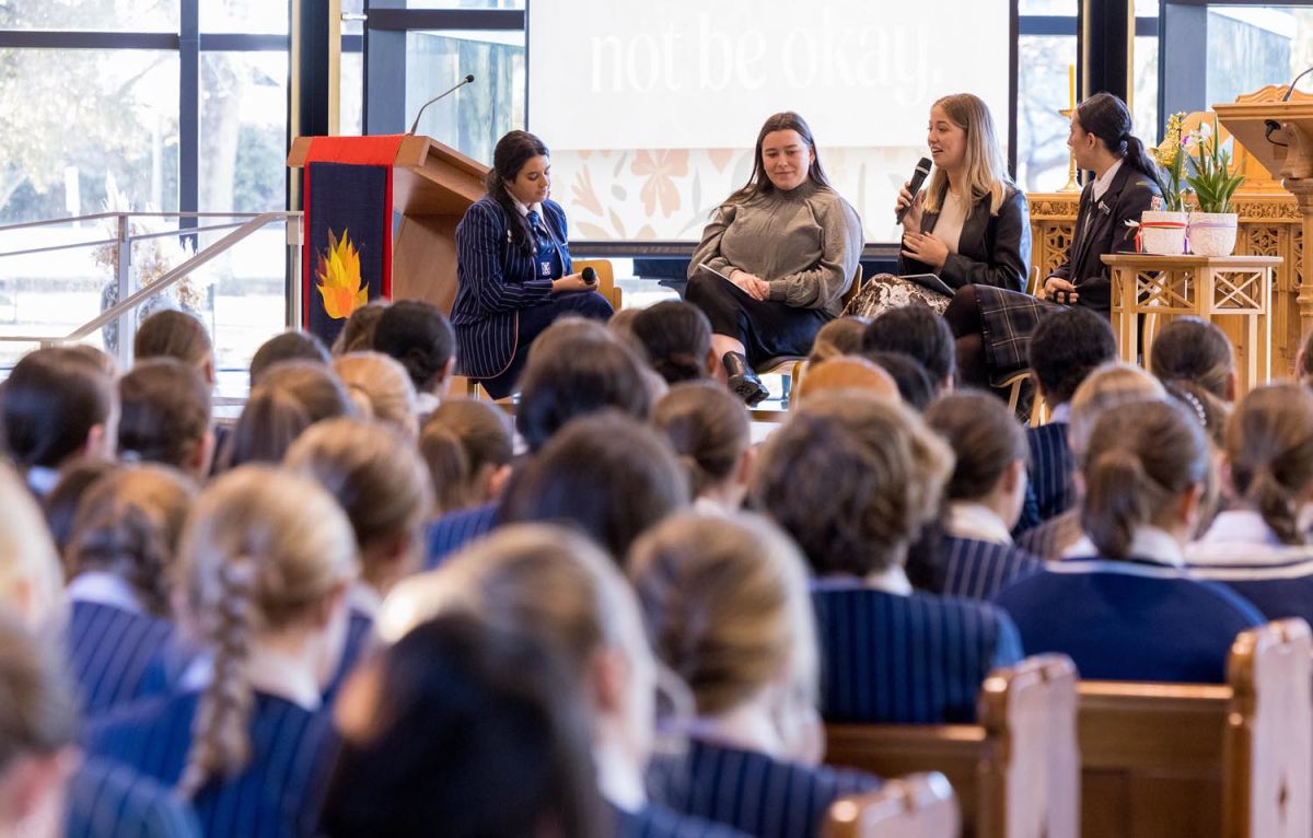 St Andrew's College past students speaking at a Girls' Assembly.