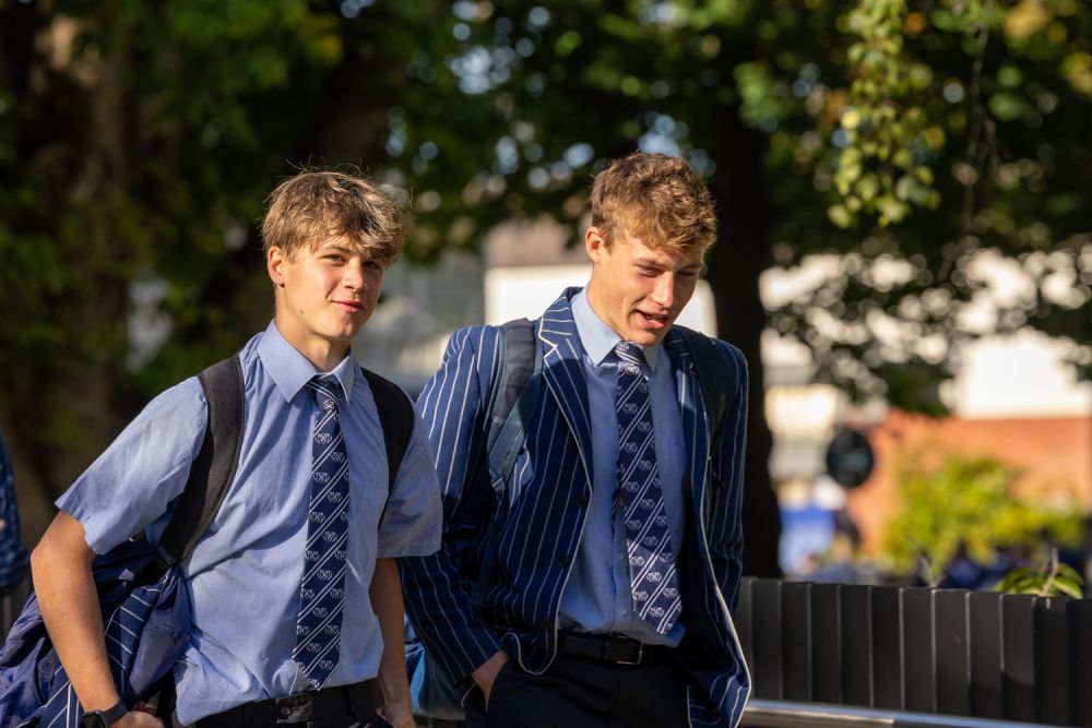 Students walking together through St Andrew's College campus